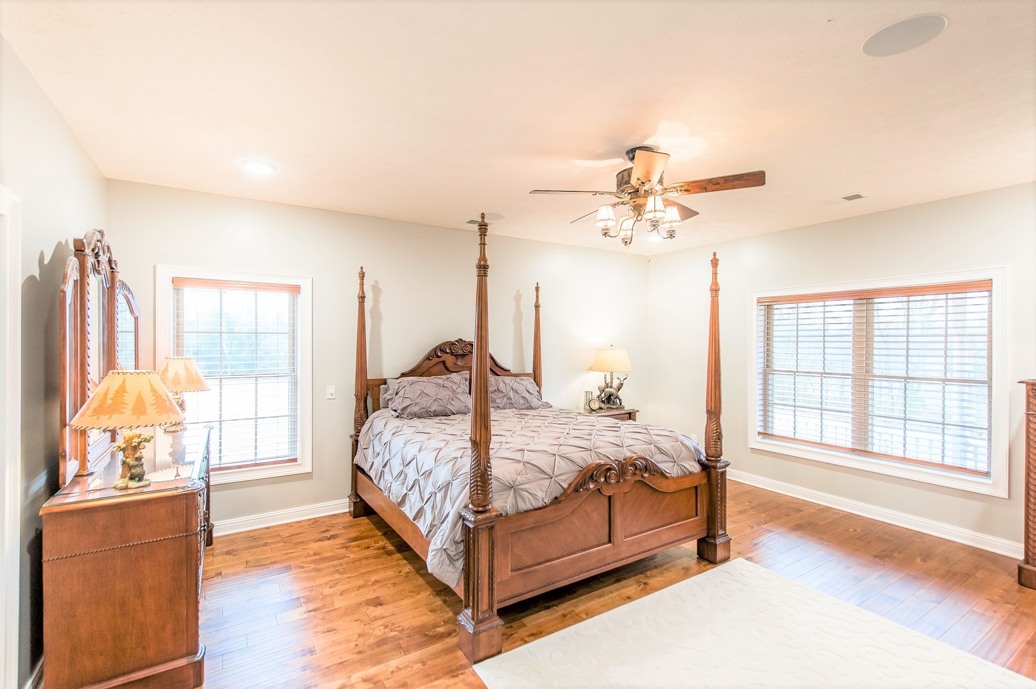 800 Butler Road Portland, TN 37148 - Photo 13 of 38 a bedroom with a large bed and a chandelier