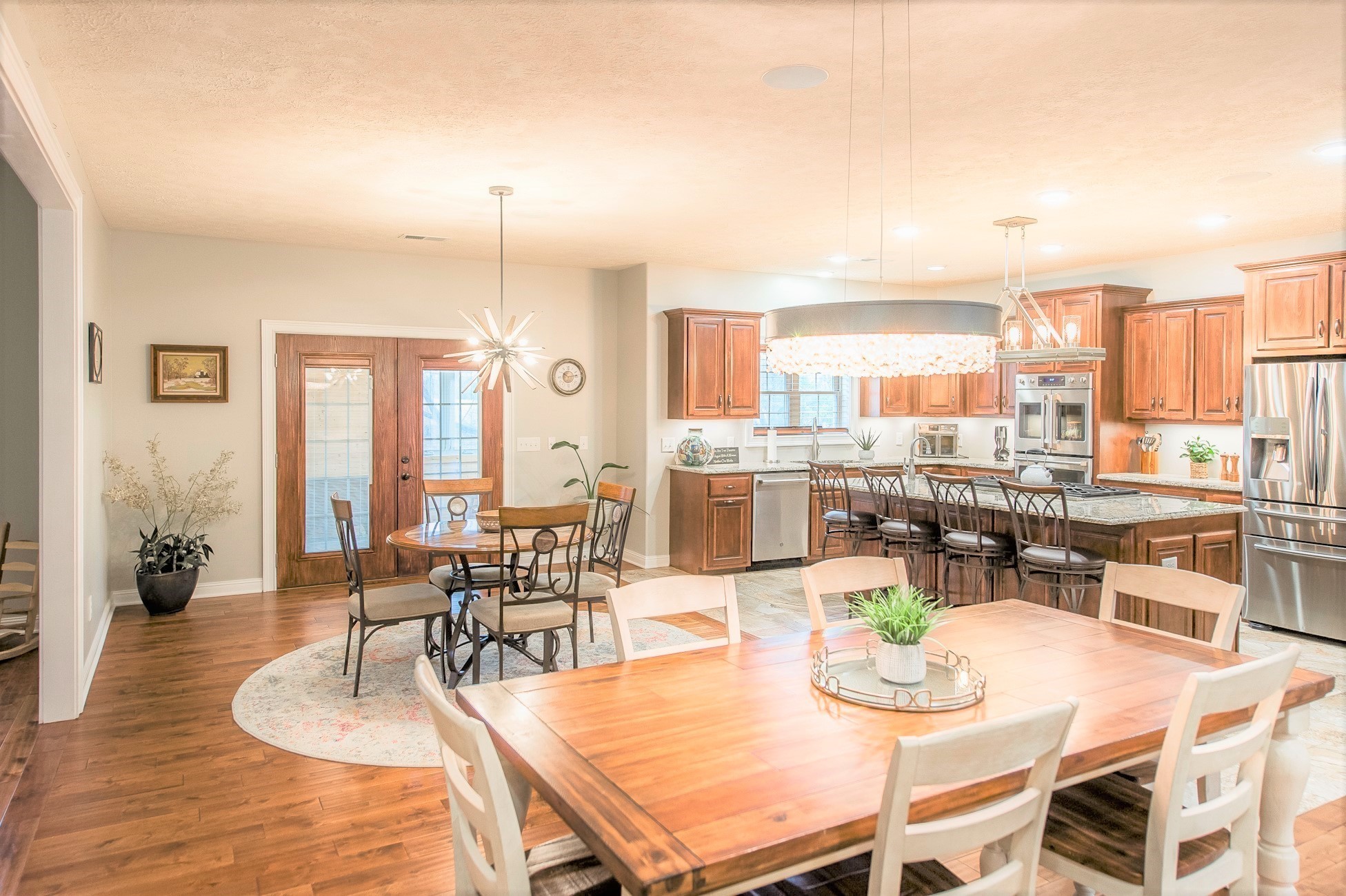 800 Butler Road Portland, TN 37148 - Photo 17 of 38 a dining room with furniture a chandelier and wooden floor