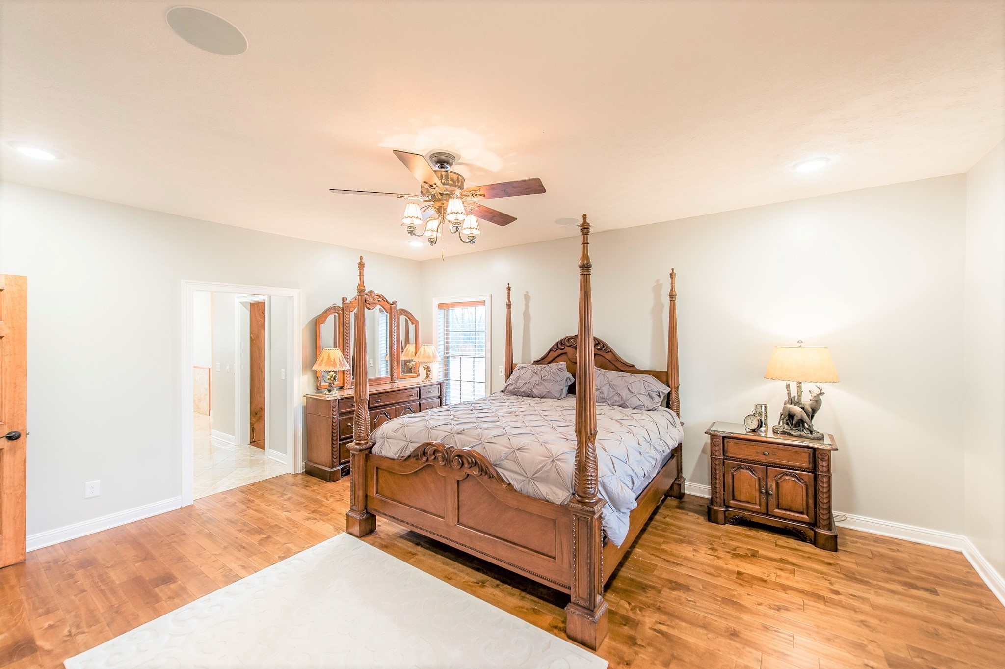 800 Butler Road Portland, TN 37148 - Photo 26 of 38 a bedroom with a bed and a chandelier