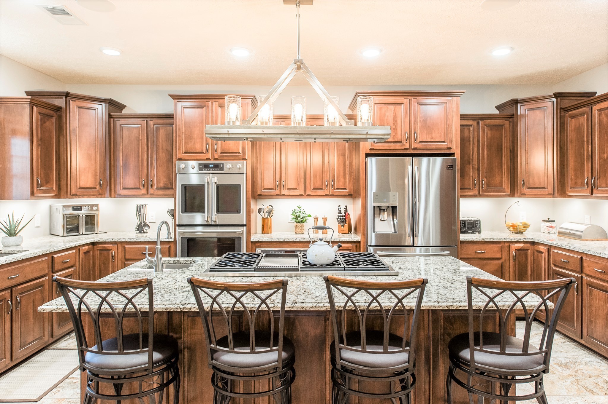 800 Butler Road Portland, TN 37148 - Photo 4 of 38 a kitchen with a dining table chairs and a refrigerator