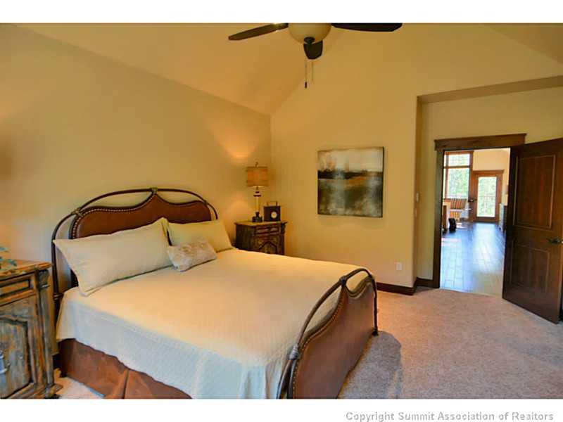 853 Independence Road, Unit 5B Keystone, CO 80435 - Photo 14 of 25 a bedroom with a bed and a painting on the wall
