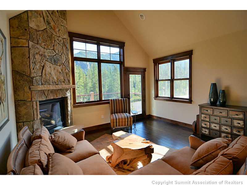 853 Independence Road, Unit 5B Keystone, CO 80435 - Photo 3 of 25 a living room with furniture and a fireplace