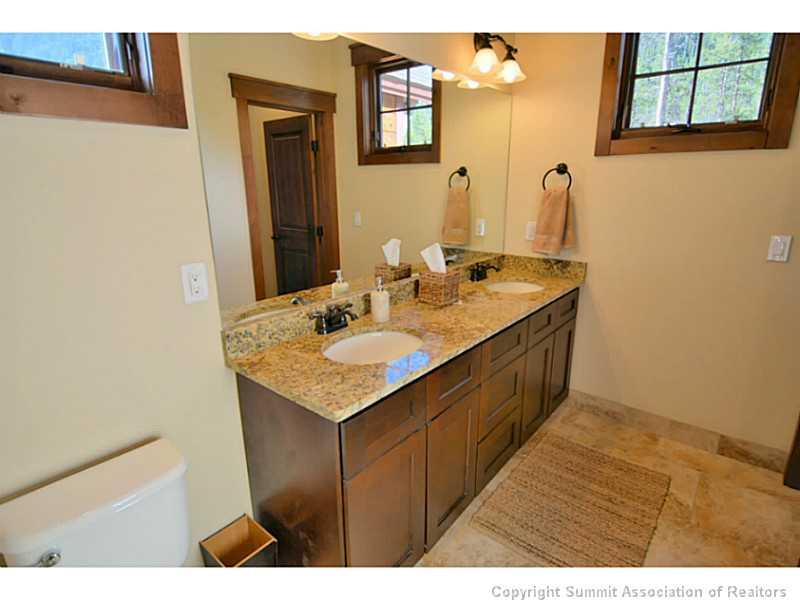 853 Independence Road, Unit 5B Keystone, CO 80435 - Photo 22 of 25 a bathroom with a sink and a mirror