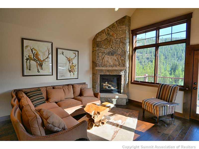 853 Independence Road, Unit 5B Keystone, CO 80435 - Photo 4 of 25 a living room with furniture a rug and a fireplace