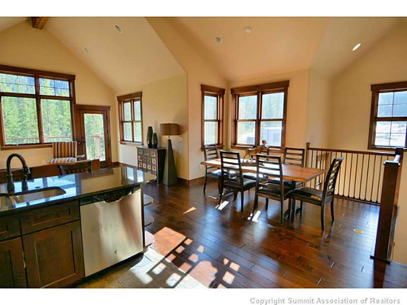 853 Independence Road, Unit 5B Keystone, CO 80435 - Photo 10 of 25 a view of a dining room with furniture window and wooden floor