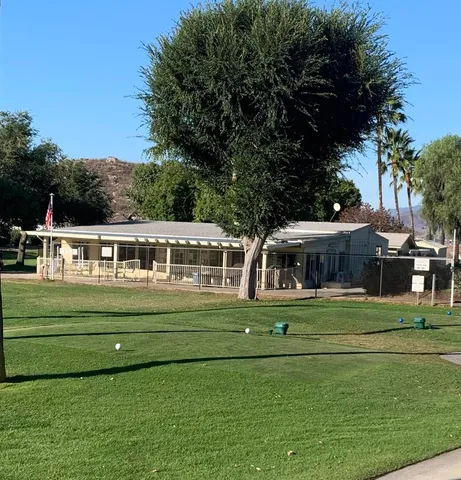 a view of a golf course with a lake