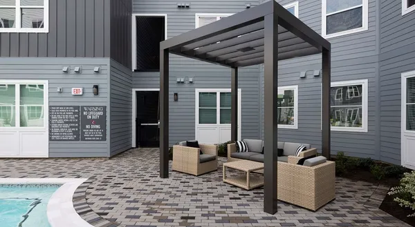 a view of a patio with table and chairs and potted plants