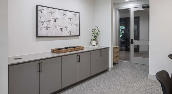 a kitchen with cabinets and window