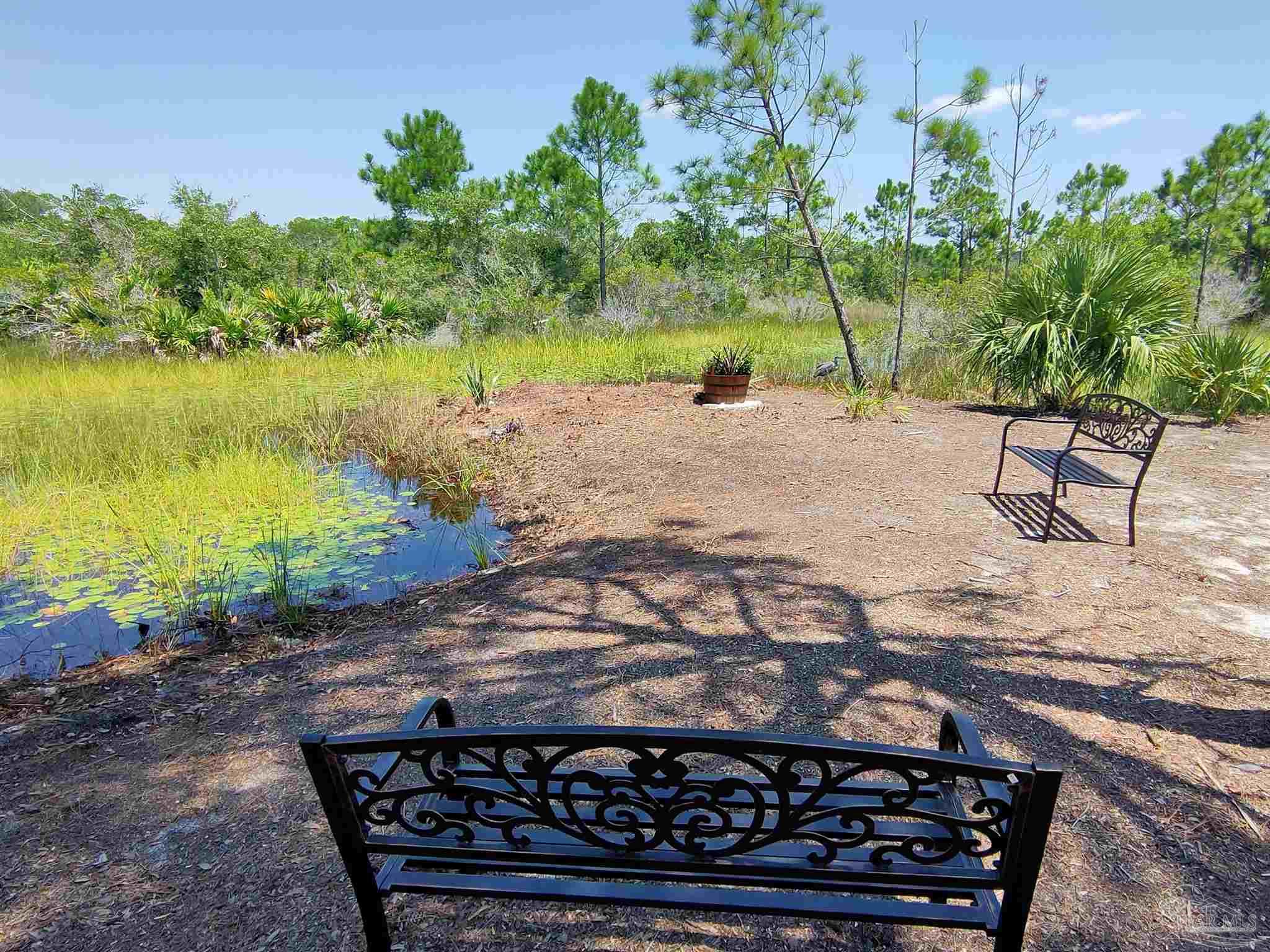 864 Sailfish Court Perdido Key, FL 32507 - Photo 15 of 40 a view of a backyard of the house