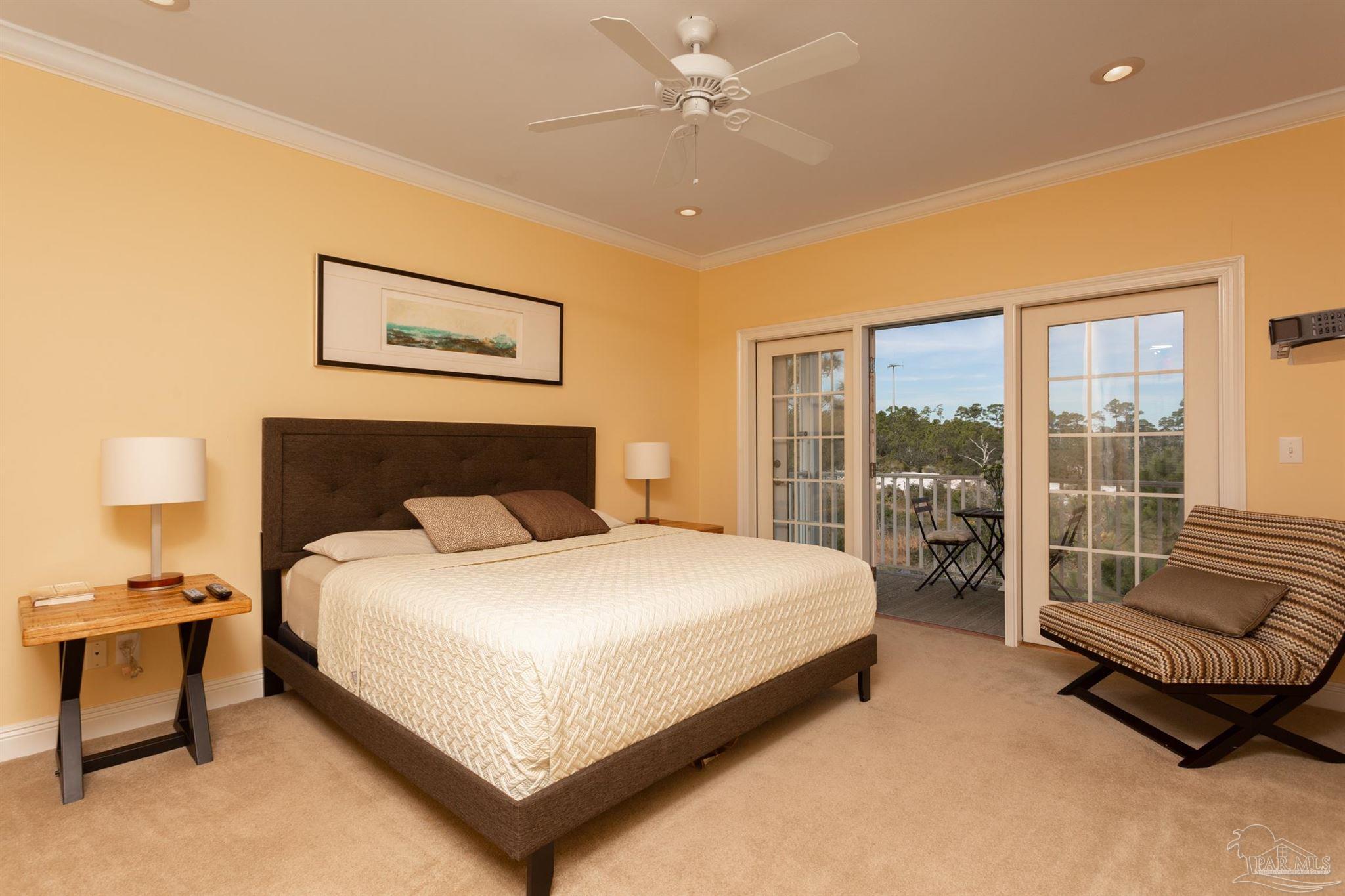 864 Sailfish Court Perdido Key, FL 32507 - Photo 17 of 40 a bedroom with a bed and a couch