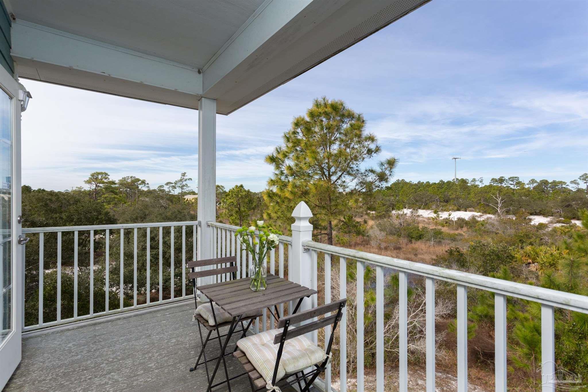 864 Sailfish Court Perdido Key, FL 32507 - Photo 18 of 40 a view of a balcony with wooden floor & fence