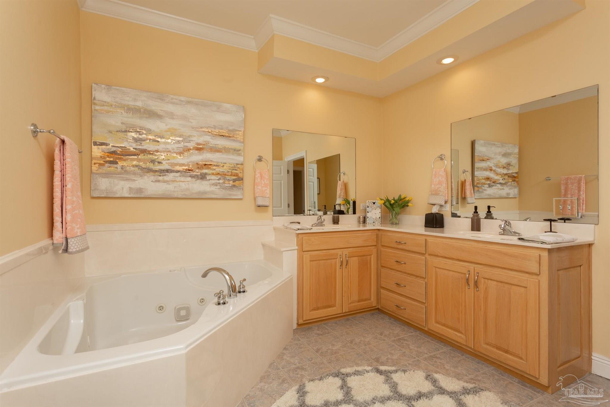864 Sailfish Court Perdido Key, FL 32507 - Photo 20 of 40 a large bathroom with a large tub and sink