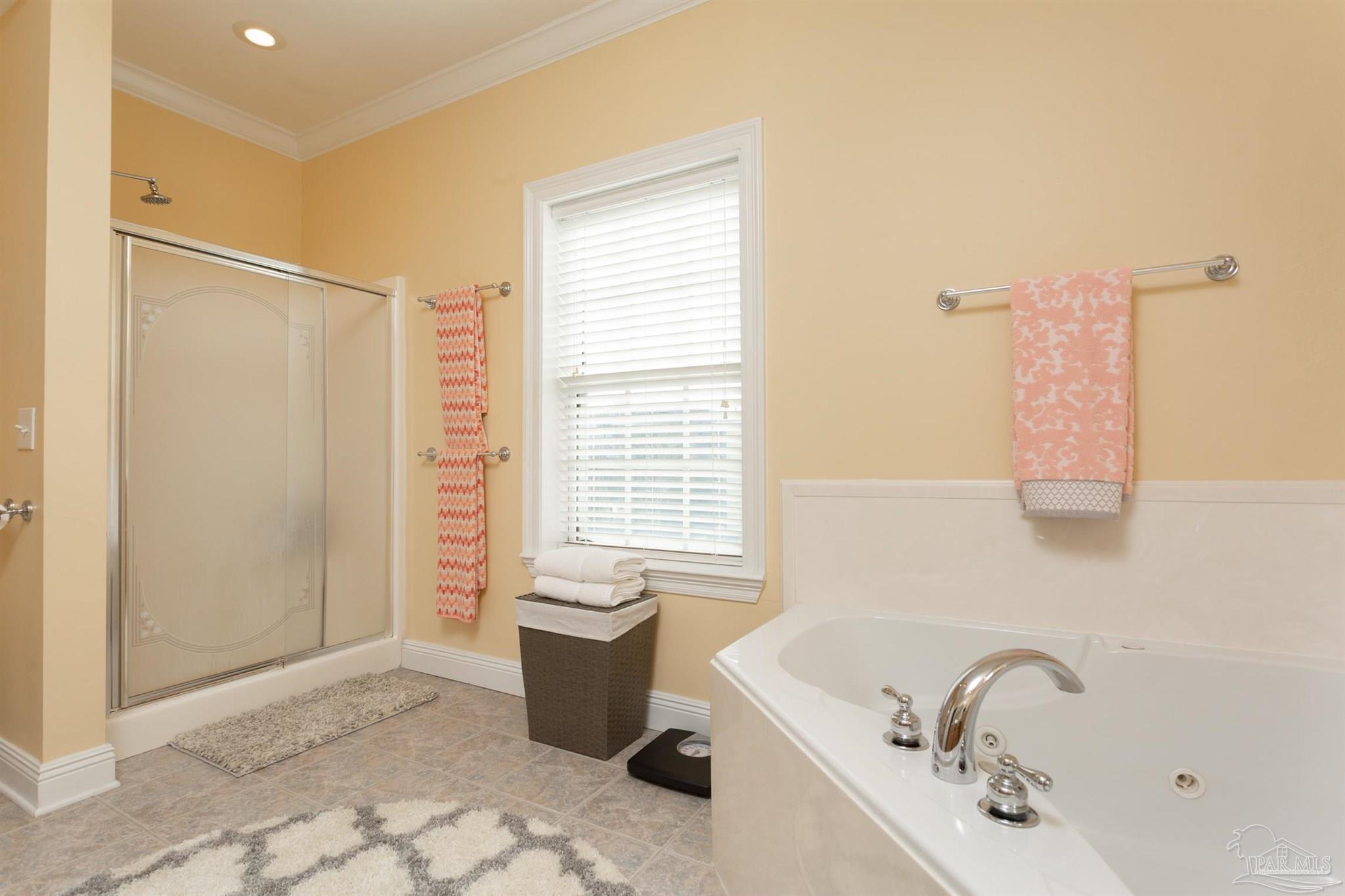 864 Sailfish Court Perdido Key, FL 32507 - Photo 21 of 40 a bath room with a bath tub and a shower