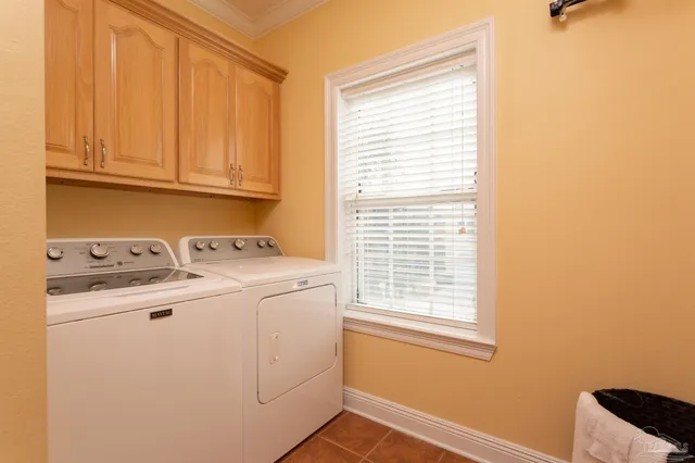 a bedroom with a bunk bed and a window