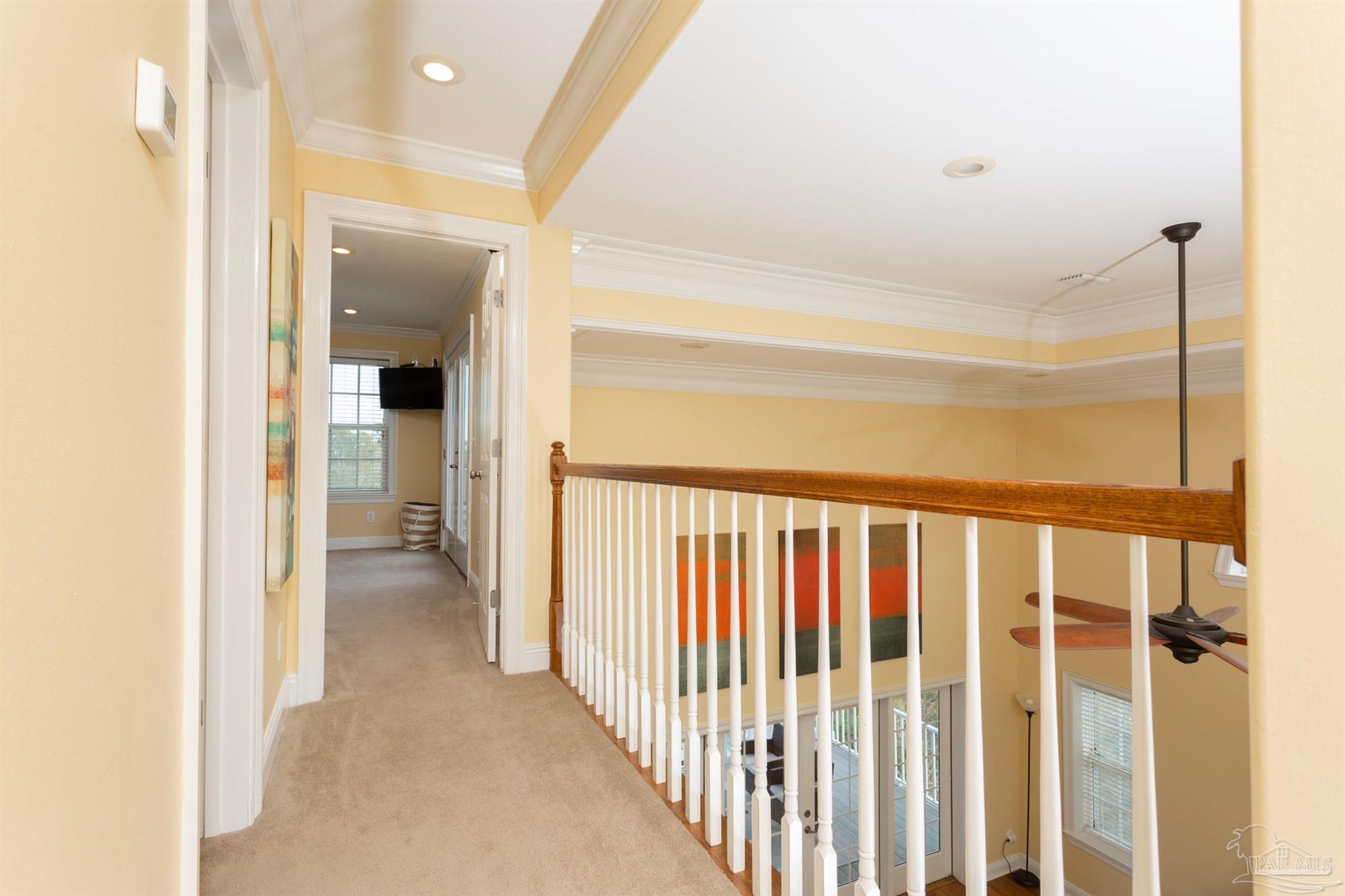 864 Sailfish Court Perdido Key, FL 32507 - Photo 23 of 40 a view of a hallway with wooden cabinets