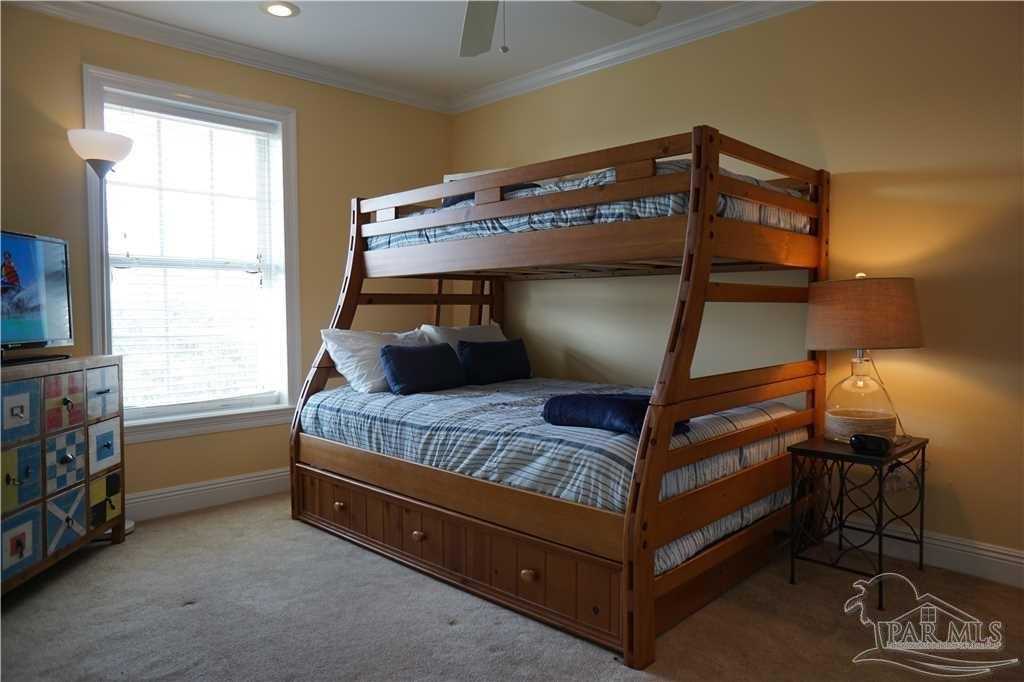 864 Sailfish Court Perdido Key, FL 32507 - Photo 30 of 40 a bedroom with a bunk bed and a window