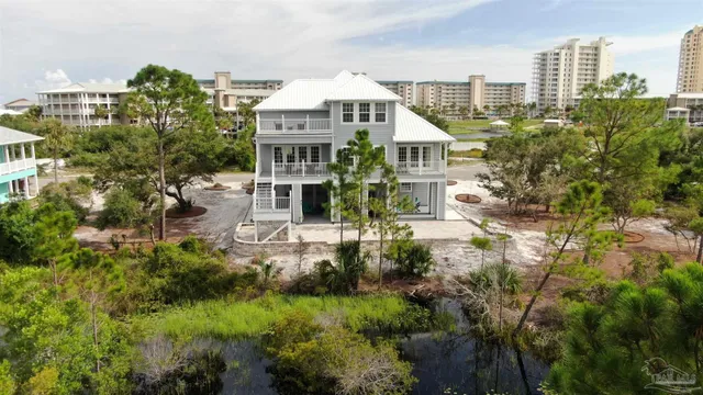 a aerial view of a house with a yard and plants