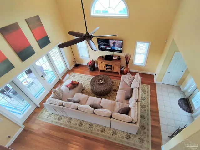 a living room with furniture and a flat screen tv