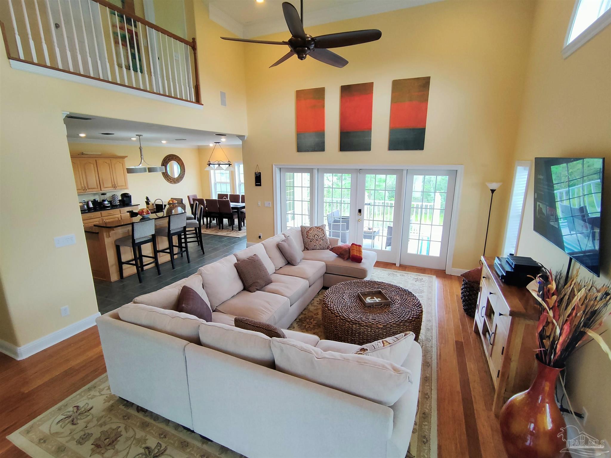 864 Sailfish Court Perdido Key, FL 32507 - Photo 9 of 40 a living room with furniture fireplace and wooden floor