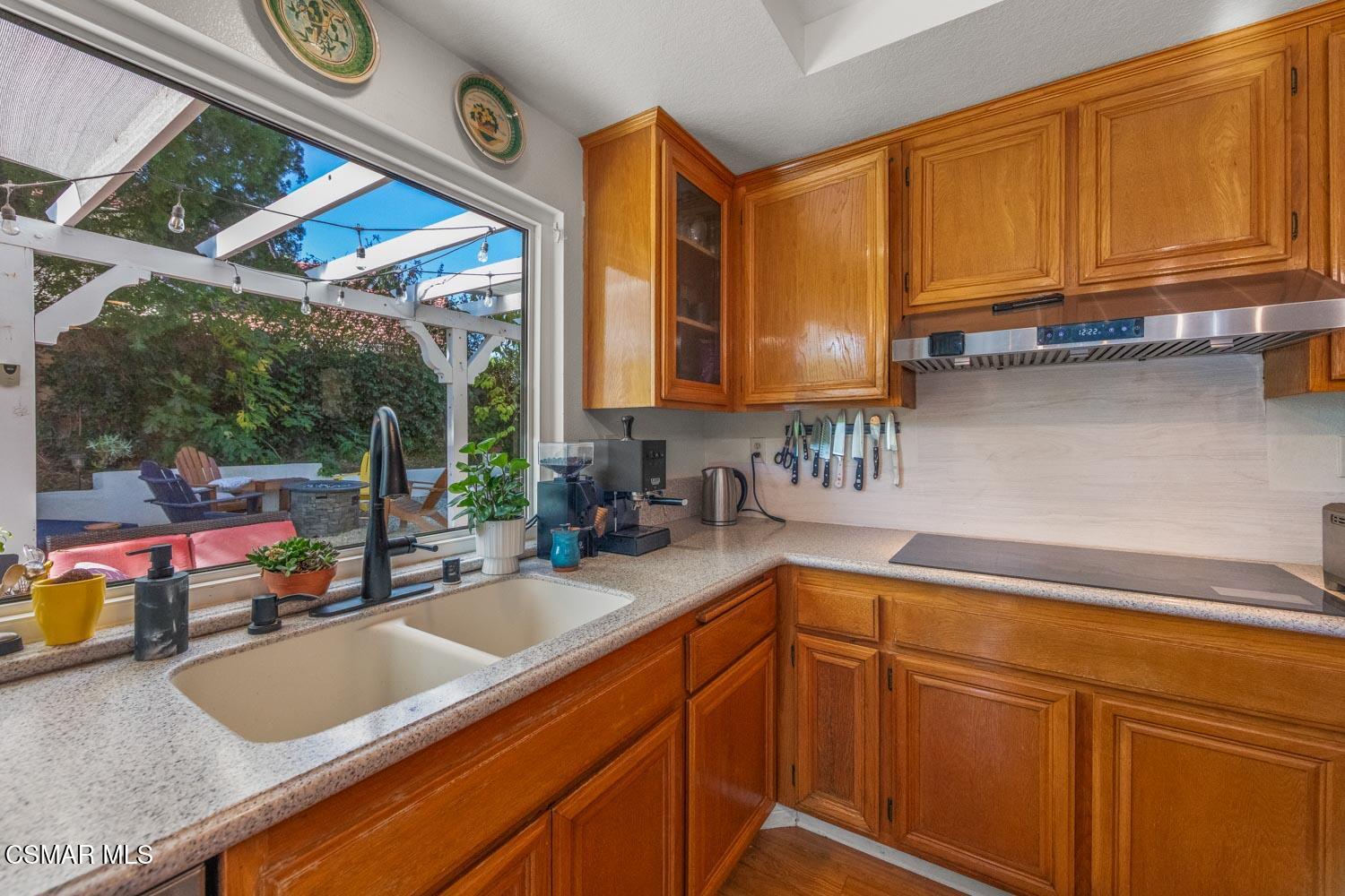 3037 Klamath Avenue Simi Valley, CA 93063 - Photo 12 of 38 a kitchen with stainless steel appliances granite countertop a sink a stove and cabinets