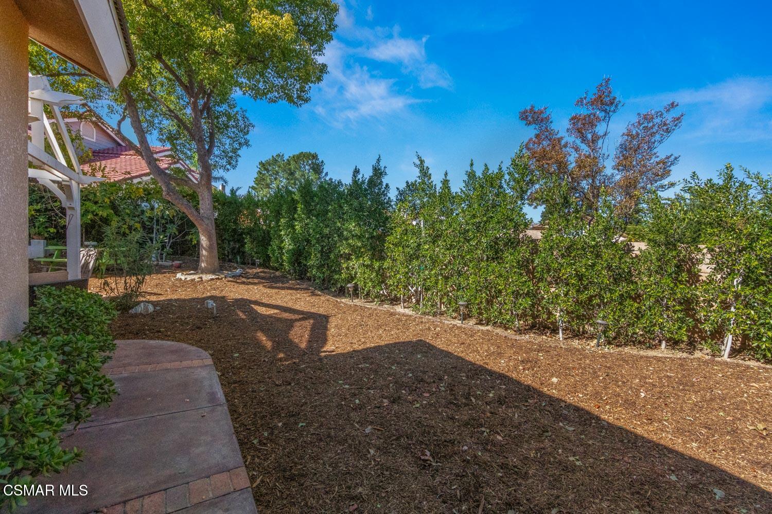 3037 Klamath Avenue Simi Valley, CA 93063 - Photo 29 of 38 a view of a yard with a tree
