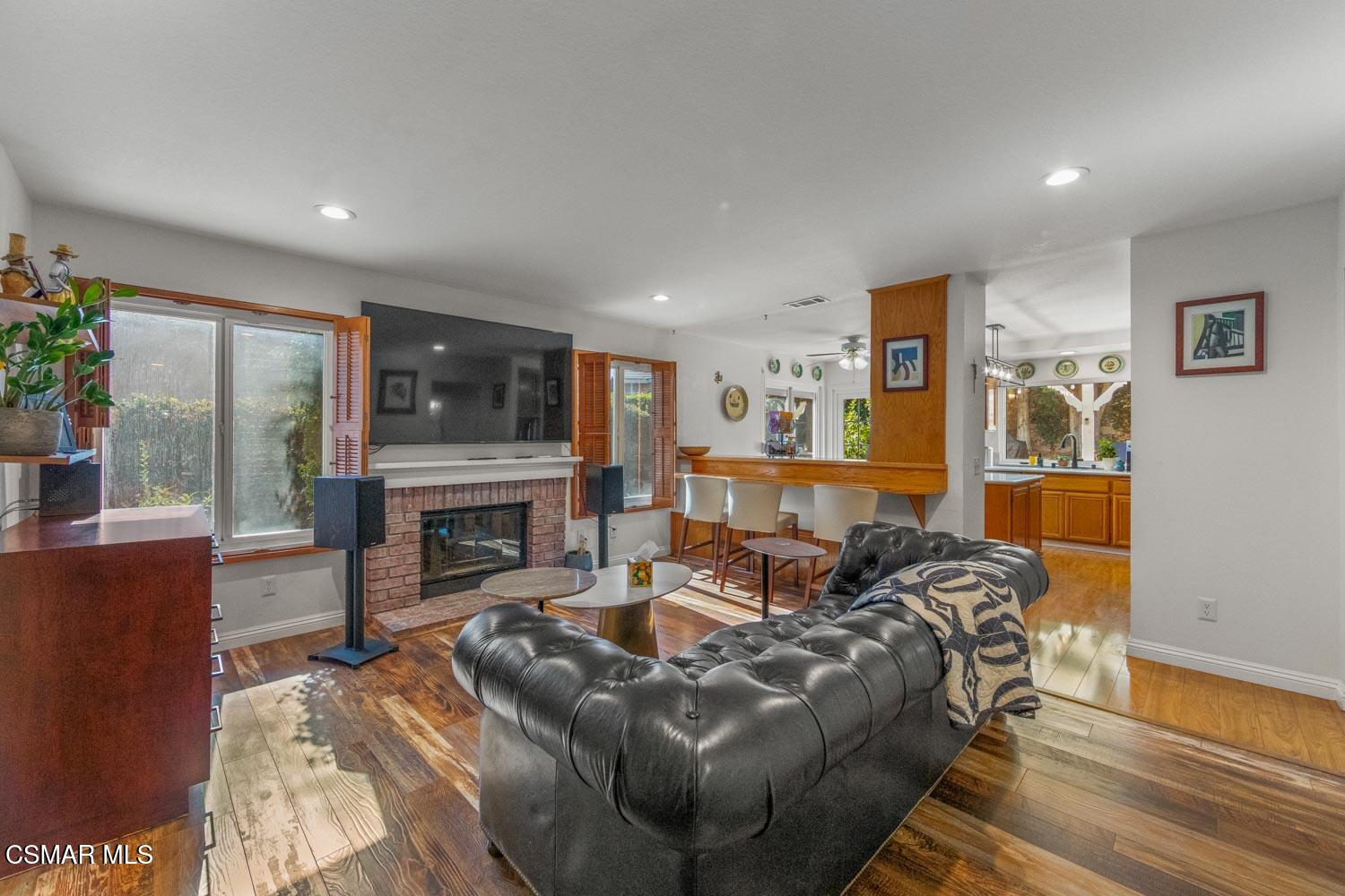 3037 Klamath Avenue Simi Valley, CA 93063 - Photo 8 of 38 a living room with furniture and a fireplace