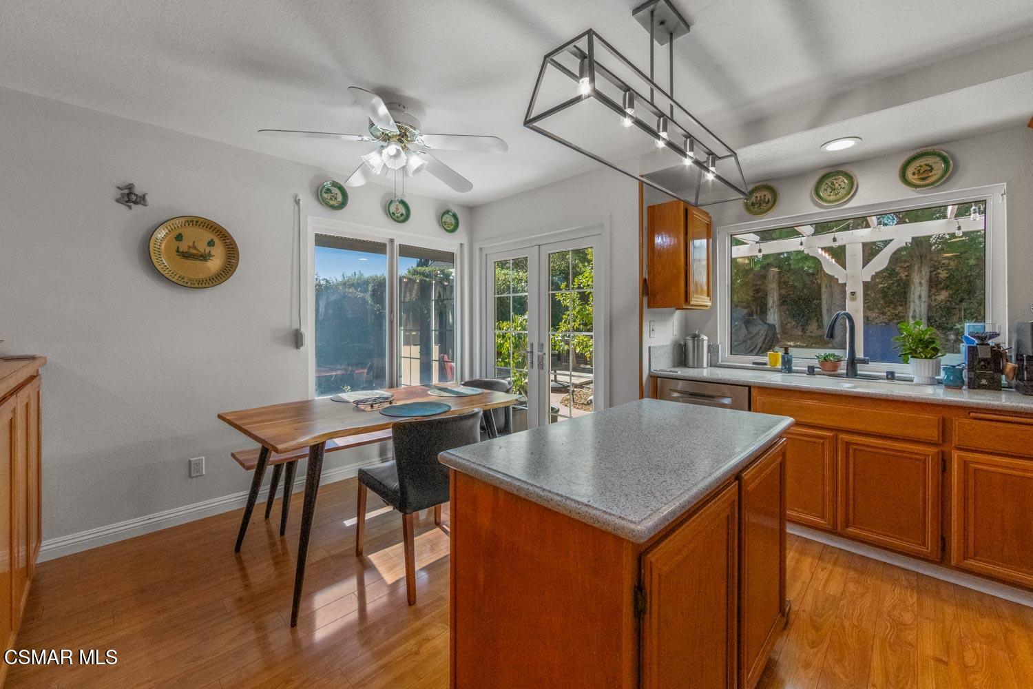 3037 Klamath Avenue Simi Valley, CA 93063 - Photo 10 of 38 a kitchen with a table chairs and wooden floor