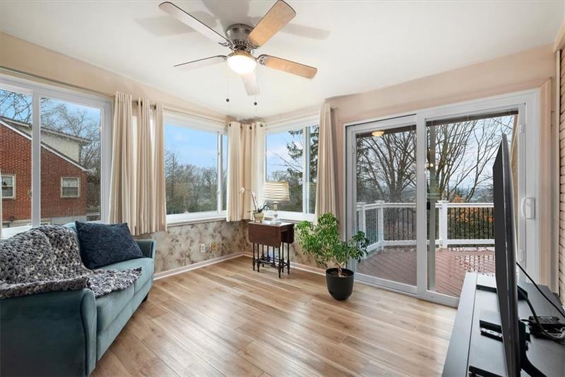 209 Cherokee Road Pittsburgh, PA 15241 - Photo 11 of 41 a living room with furniture large windows and wooden floor