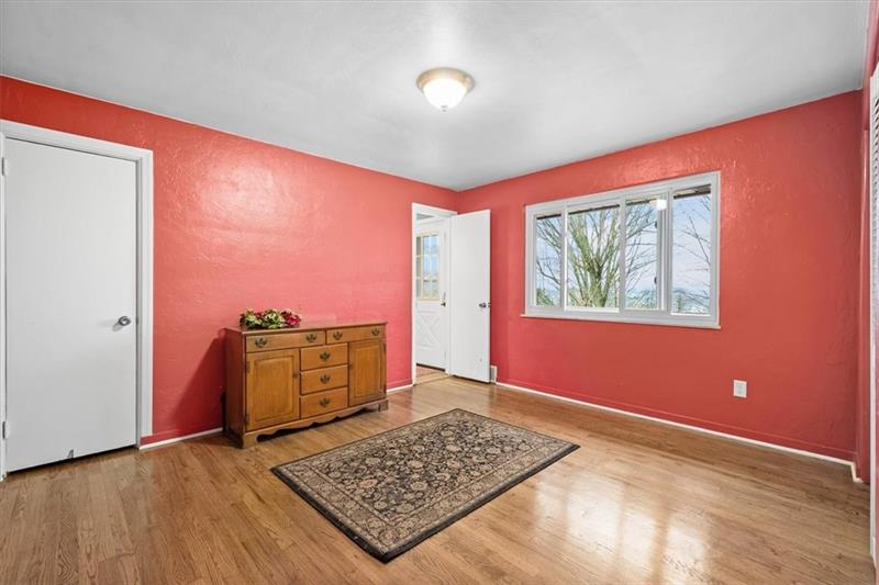 209 Cherokee Road Pittsburgh, PA 15241 - Photo 24 of 41 a view of an empty room window and wooden floor