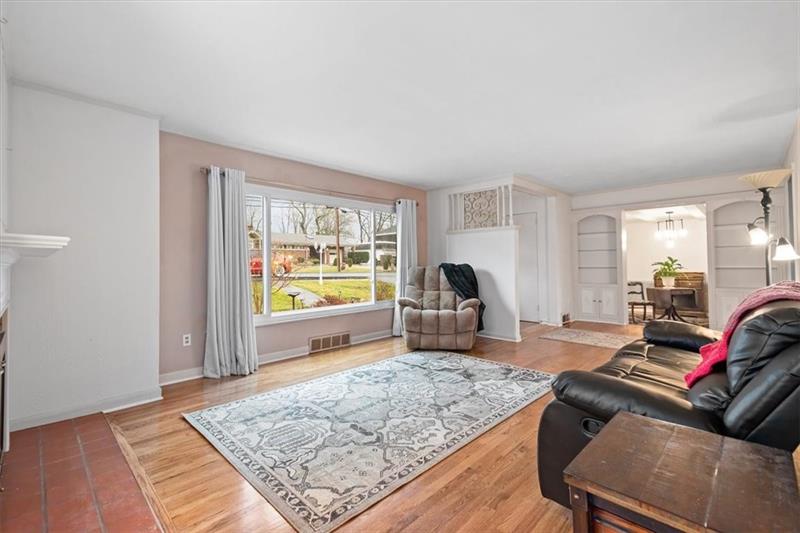 209 Cherokee Road Pittsburgh, PA 15241 - Photo 6 of 41 a living room with furniture and a rug