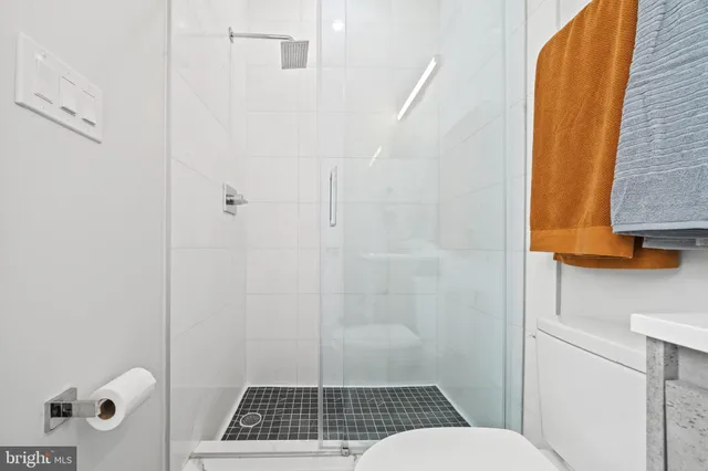 a close view of a utility room with dryer and washer