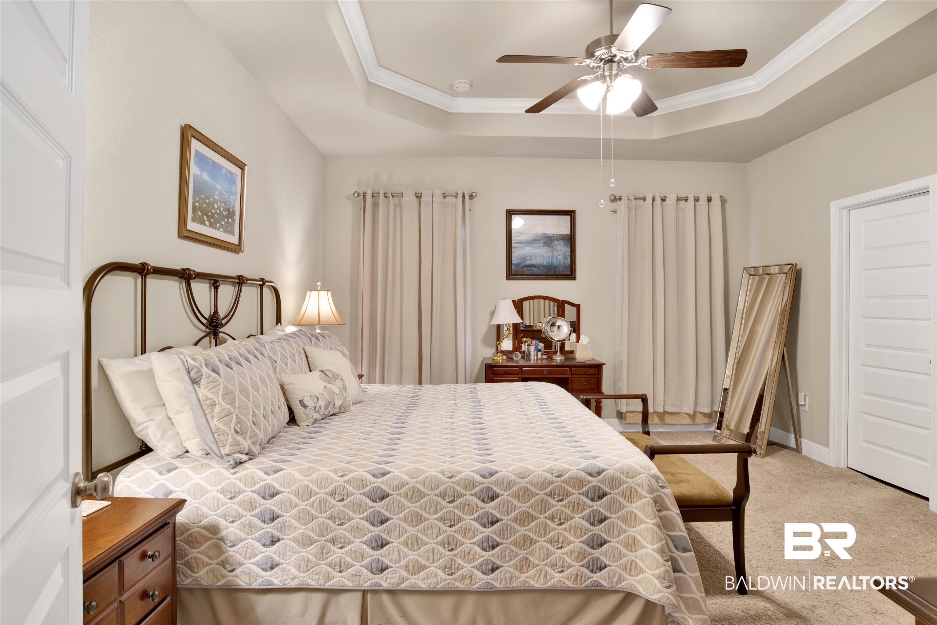 1476 Surrey Loop Foley, AL 36535 - Photo 23 of 31 Bedroom with a tray ceiling, ornamental molding, ceiling fan, and carpet flooring