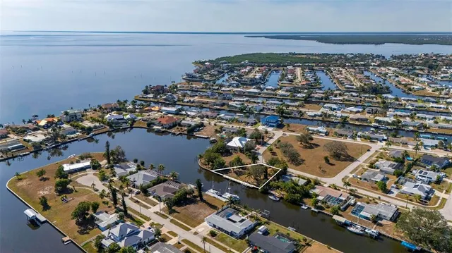 a view of a city that has tall buildings and a big yard