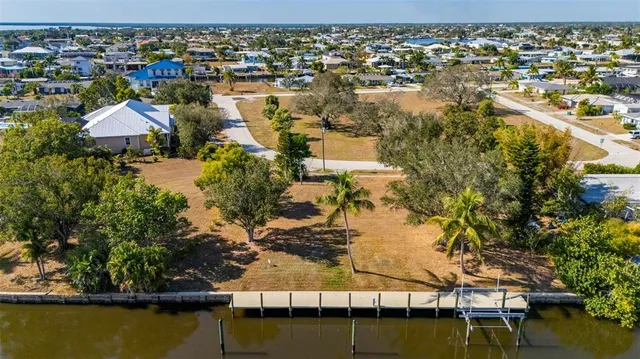 a view of a patio with a table and chairs under an umbrella