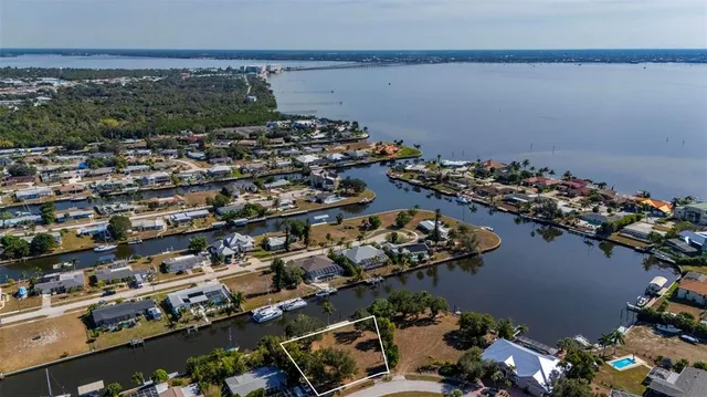 a view of a swimming pool with outdoor seating