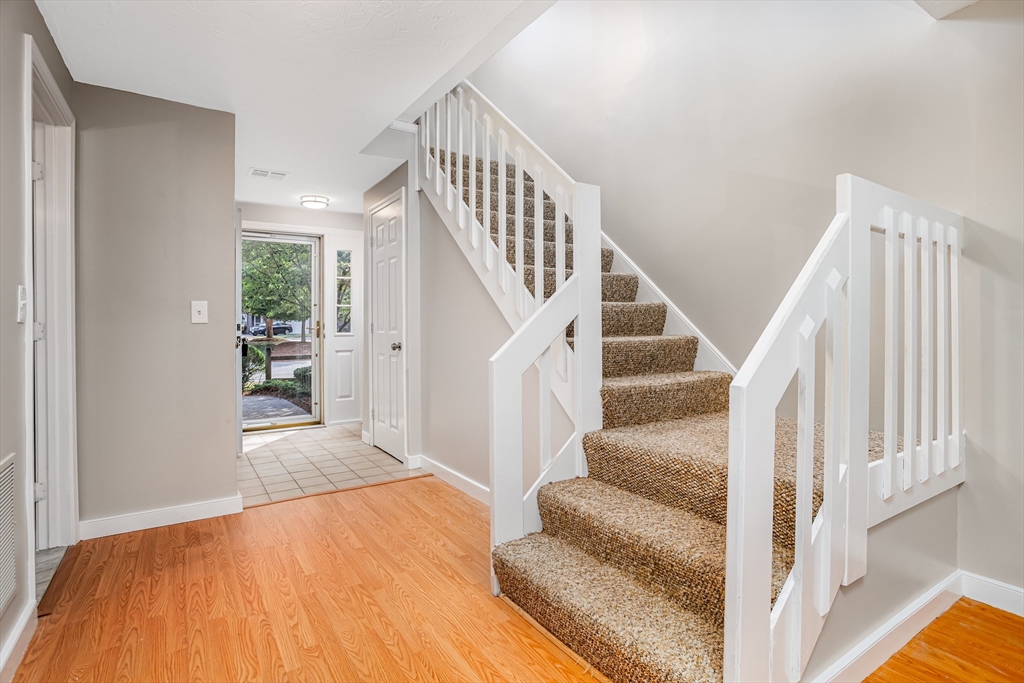 516 Ridgefield Circle, Unit C Clinton, MA 01510 - Photo 14 of 36 a view of entryway and hall with wooden floor