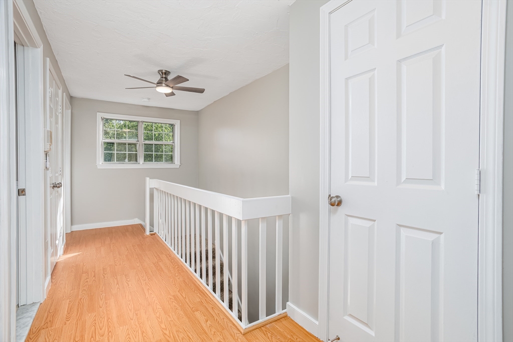 516 Ridgefield Circle, Unit C Clinton, MA 01510 - Photo 15 of 36 a view of a hallway with windows