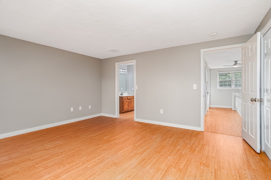 516 Ridgefield Circle, Unit C Clinton, MA 01510 - Photo 16 of 36 a view of an empty room with wooden floor