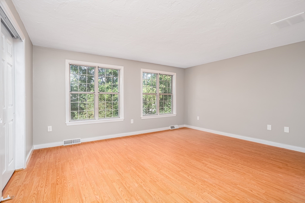 516 Ridgefield Circle, Unit C Clinton, MA 01510 - Photo 17 of 36 a view of an empty room with a window
