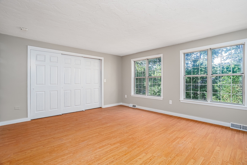 516 Ridgefield Circle, Unit C Clinton, MA 01510 - Photo 19 of 36 a view of an empty room with a window
