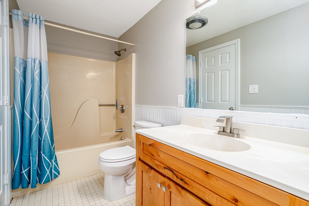516 Ridgefield Circle, Unit C Clinton, MA 01510 - Photo 23 of 36 a bathroom with a sink toilet and shower