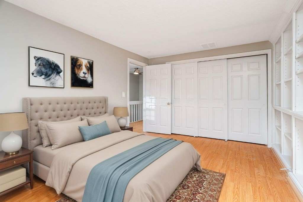 516 Ridgefield Circle, Unit C Clinton, MA 01510 - Photo 26 of 36 a bedroom with bed and cupboard