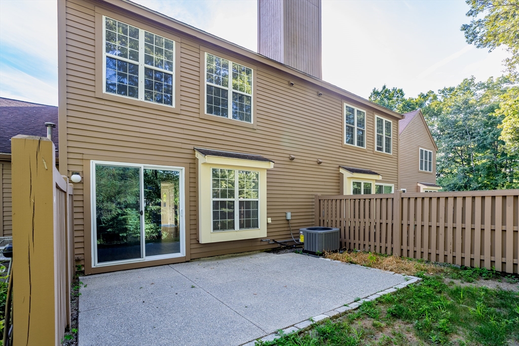 516 Ridgefield Circle, Unit C Clinton, MA 01510 - Photo 29 of 36 a view of backyard with deck and outdoor seating