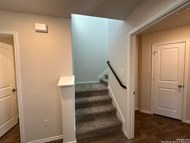 a view of entryway with wooden floor