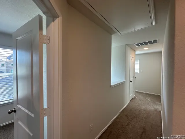 a view of a room with a hallway