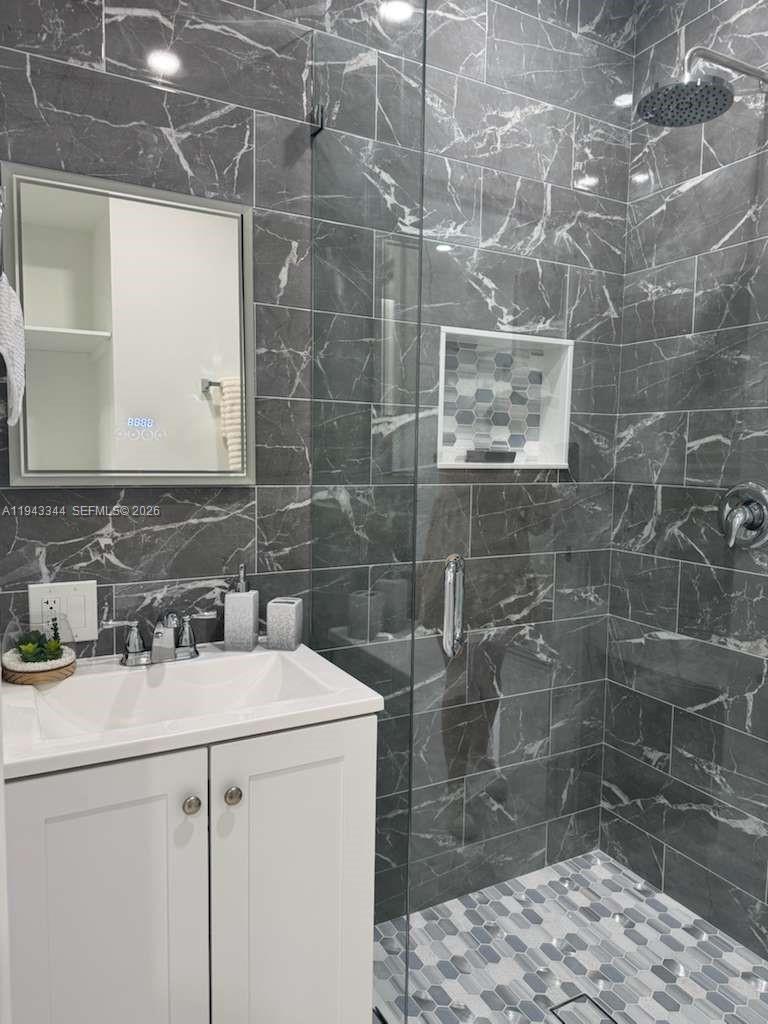 12970 Southwest 187th Street, Unit EFFICIENCY Miami, FL 33177 - Photo 11 of 30 a bathroom with a sink toilet and shower