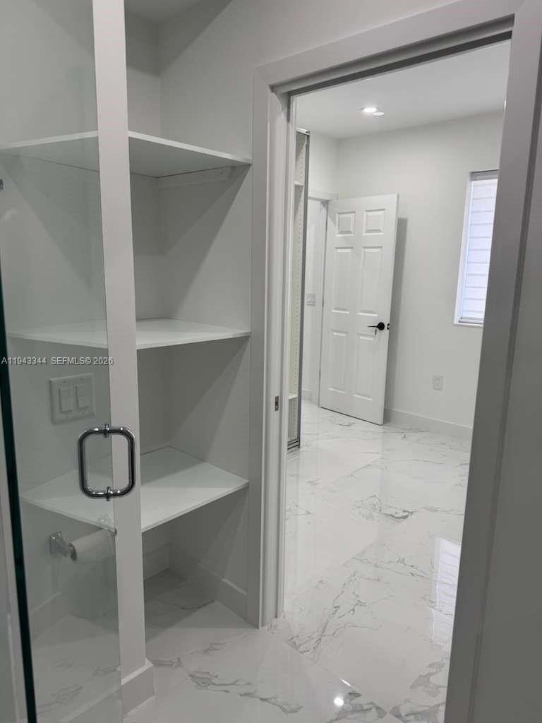 12970 Southwest 187th Street, Unit EFFICIENCY Miami, FL 33177 - Photo 12 of 30 a bathroom with a sink and a mirror