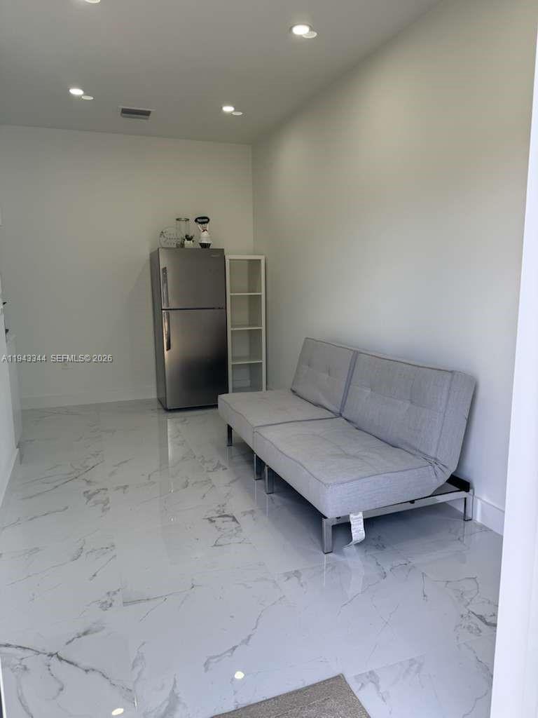 12970 Southwest 187th Street, Unit EFFICIENCY Miami, FL 33177 - Photo 30 of 30 a living room with furniture