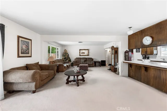 a living room with furniture and a clock