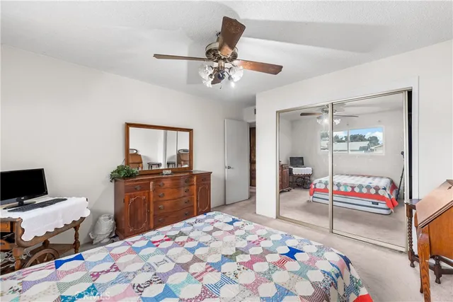 a bedroom with a bed and dresser